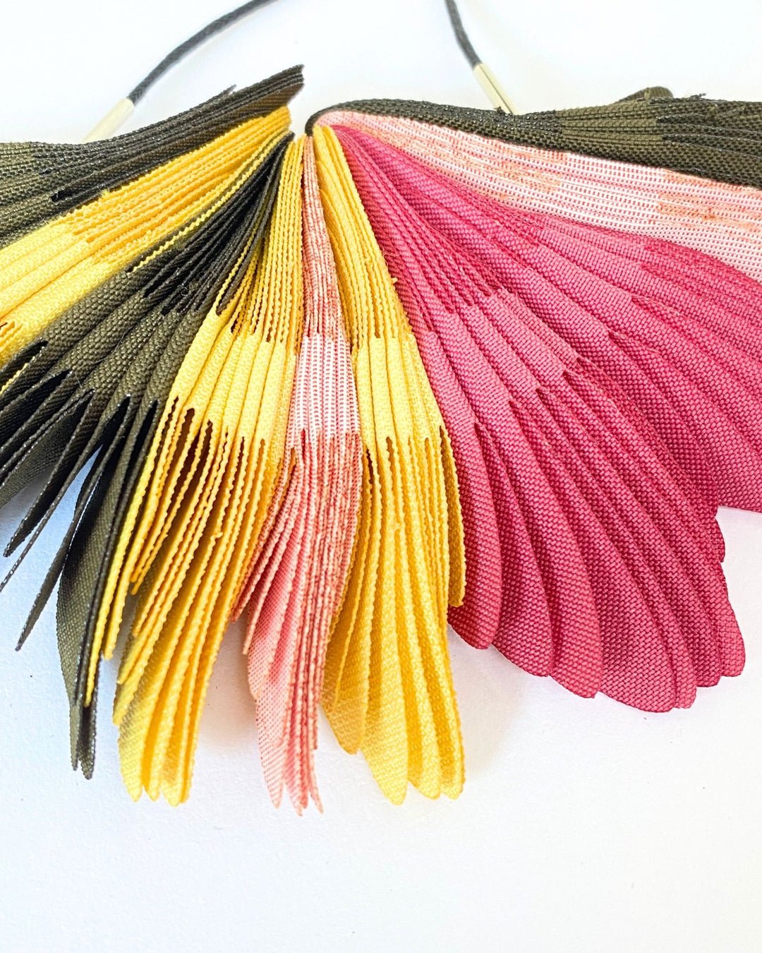 COLLAR Textil, plumas